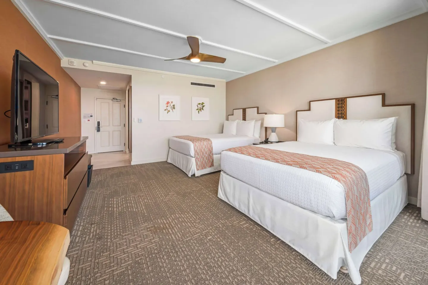 Premium Resort View room with two beds and TV console at Outrigger Kaanapali Beach Resort.