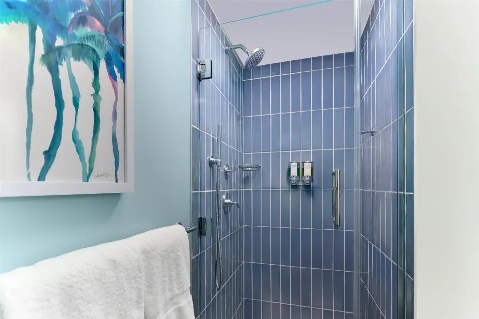 Blue-tiled shower in a Signature Room at Outrigger Kaanapali Beach Resort.