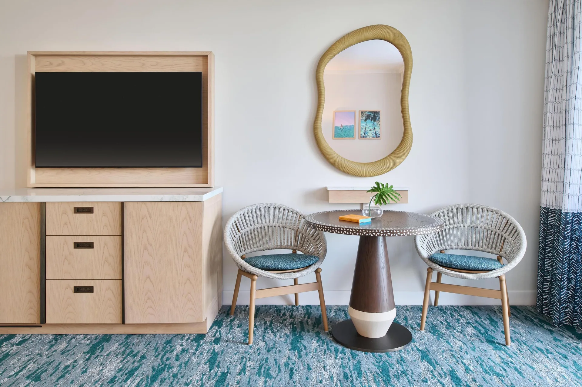 Sitting area and TV in a Signature Room at Outrigger Kaanapali Beach Resort.