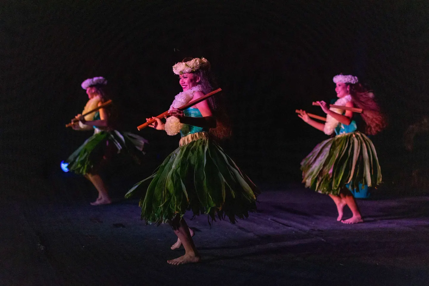 Hula dancers performing at night at Outrigger Kona Resort and Spa.