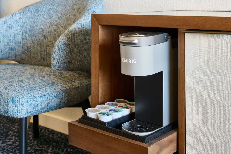 Deluxe Ocean Front Suite coffee maker nook with pods at Outrigger Kona Resort and Spa.