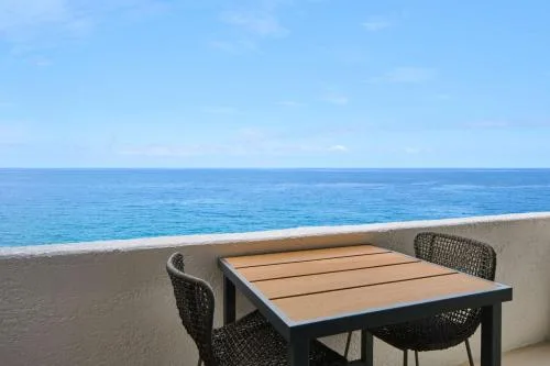 Suite balcony table overlooking the ocean at Outrigger Kona Resort and Spa.