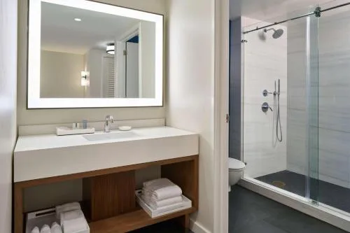 Suite bathroom vanity and glass shower at Outrigger Kona Resort and Spa.