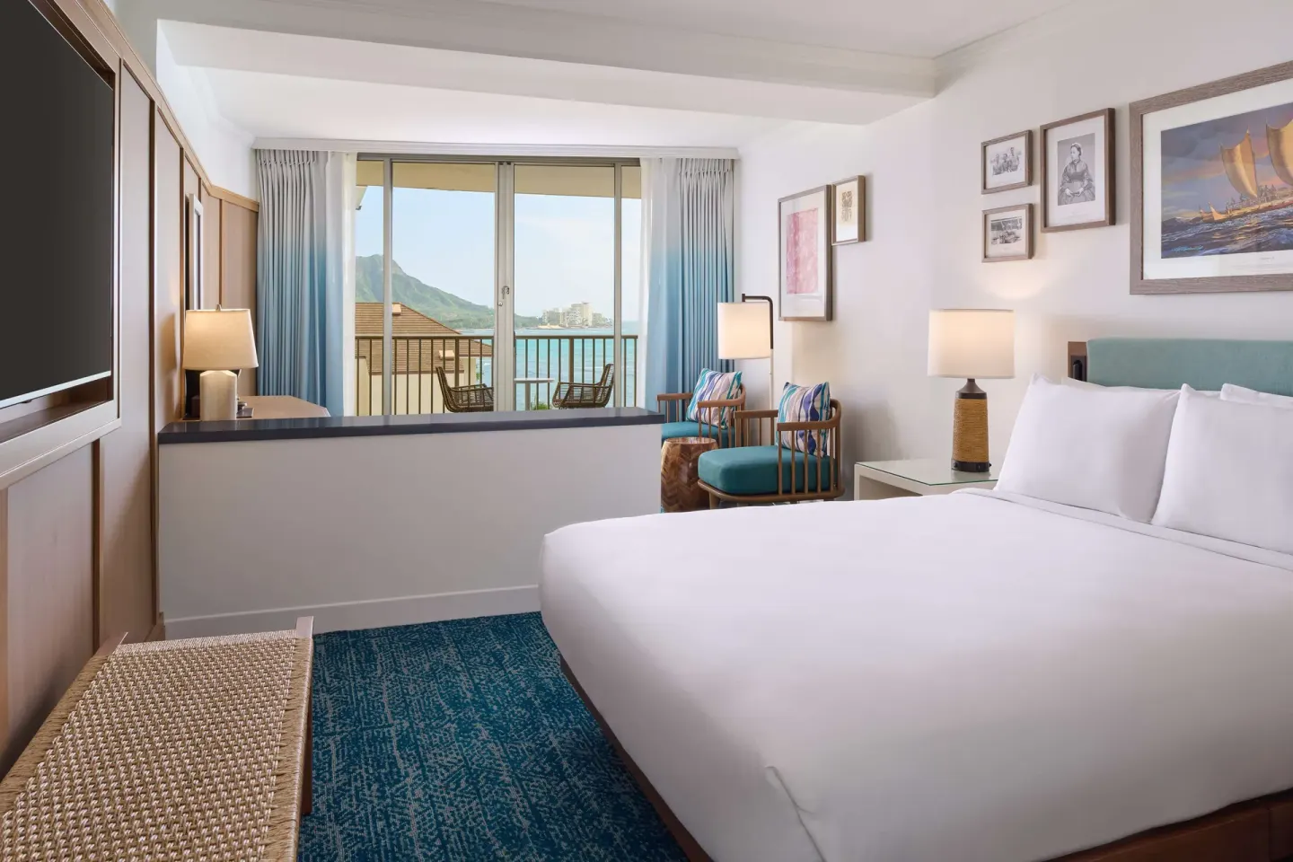 King guest room with balcony and mountain-ocean view at OUTRIGGER Reef Waikiki Beach Resort.