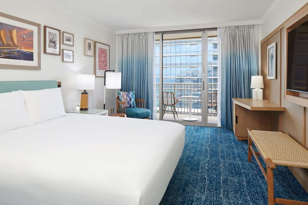 King balcony guest room with city-facing lanai at OUTRIGGER Reef Waikiki Beach Resort.