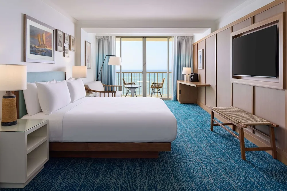 King oceanfront guest room with balcony at OUTRIGGER Reef Waikiki Beach Resort.