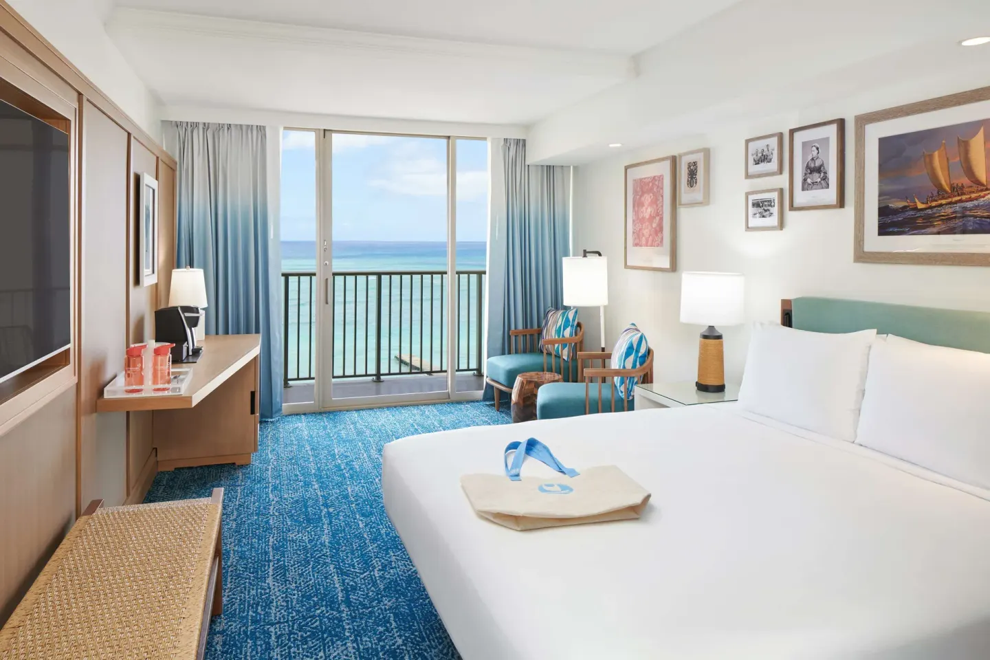 Oceanfront king guest room with balcony at OUTRIGGER Reef Waikiki Beach Resort.