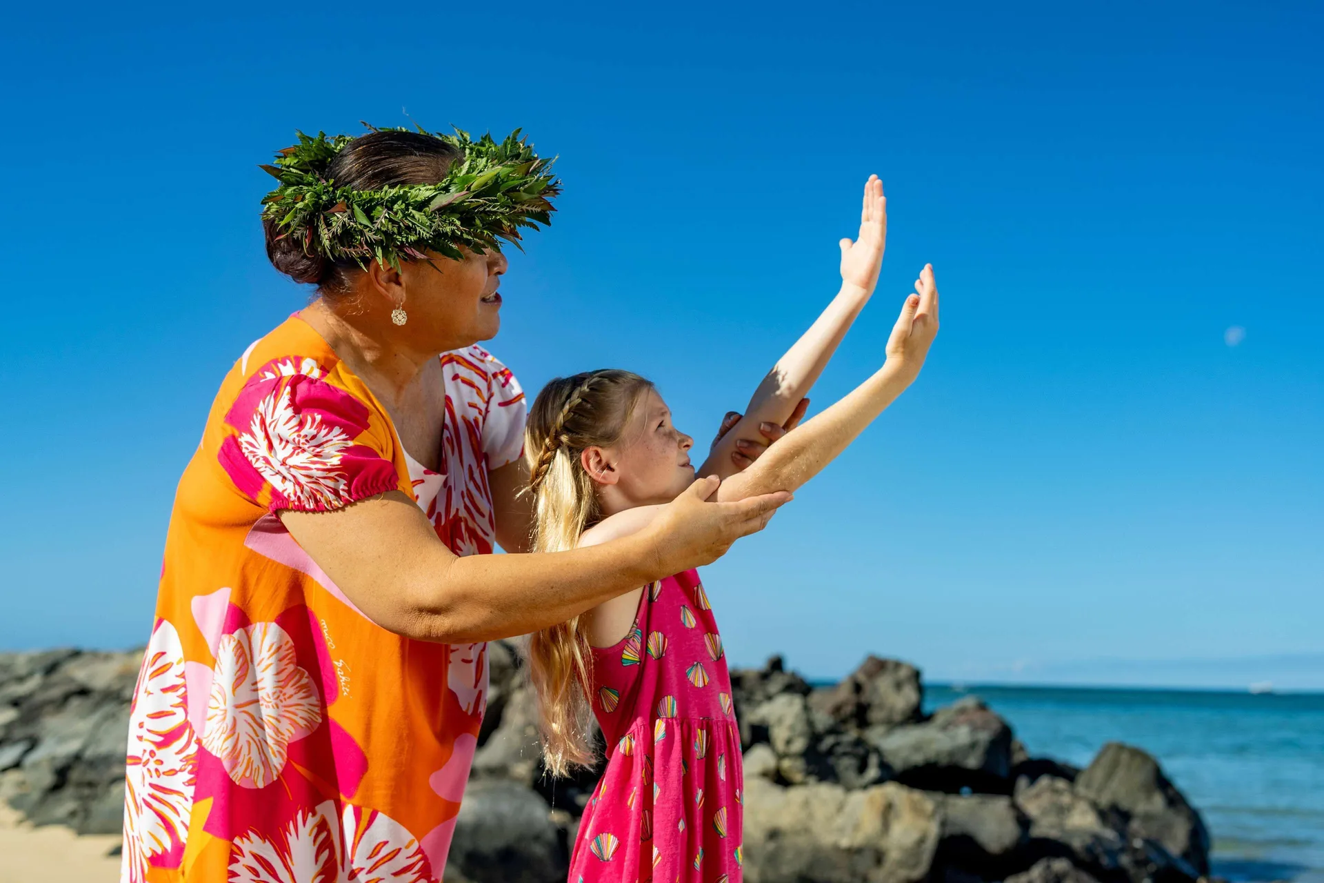 Hula lesson by the ocean at OUTRIGGER Reef Waikiki Beach Resort.