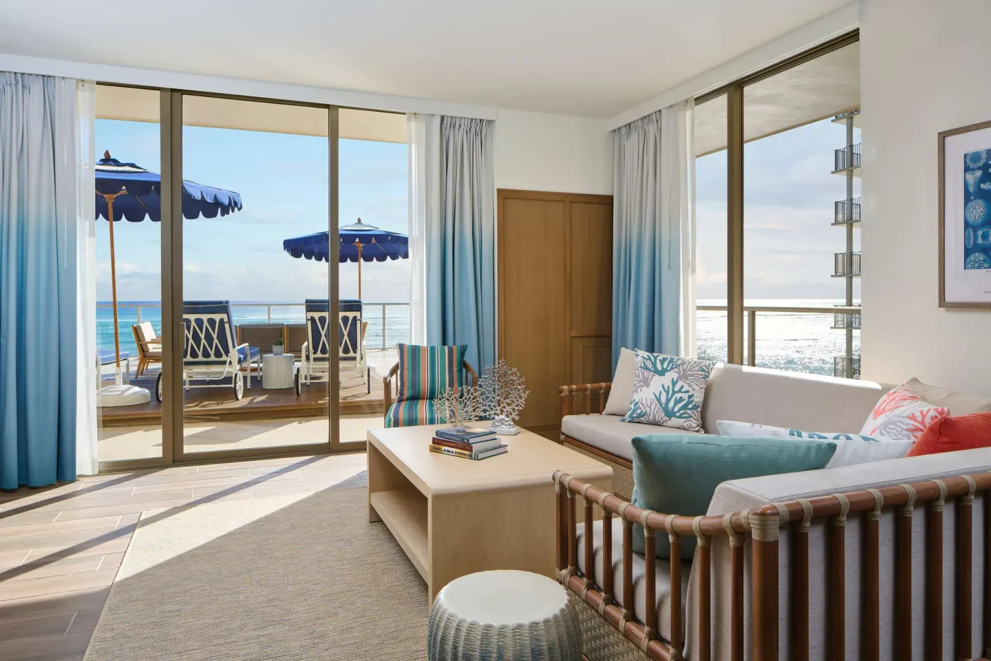 Oceanfront suite sitting area with terrace lounge chairs at OUTRIGGER Reef Waikiki Beach Resort.