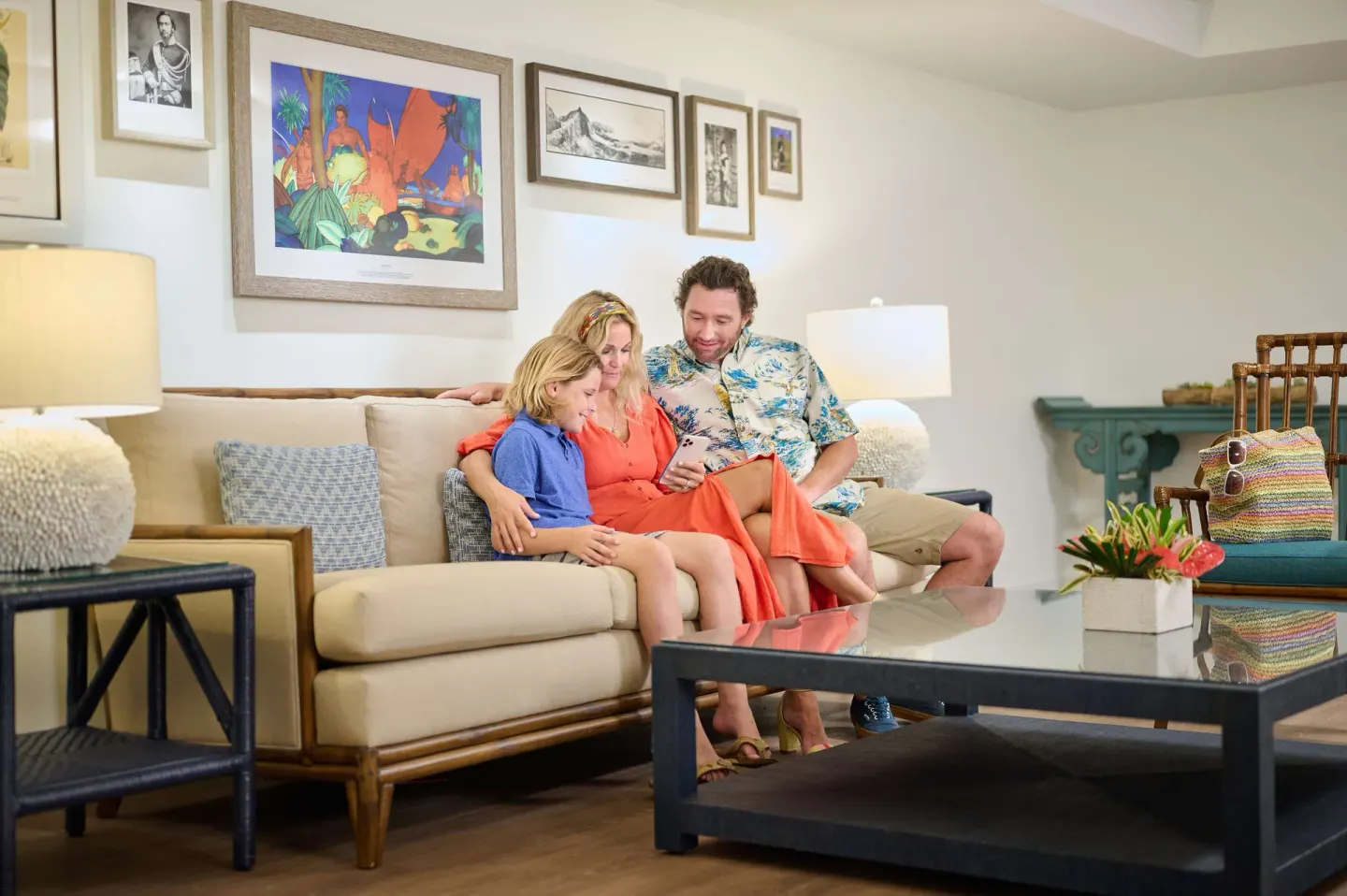 Family seated in a resort lounge at OUTRIGGER Reef Waikiki Beach Resort.