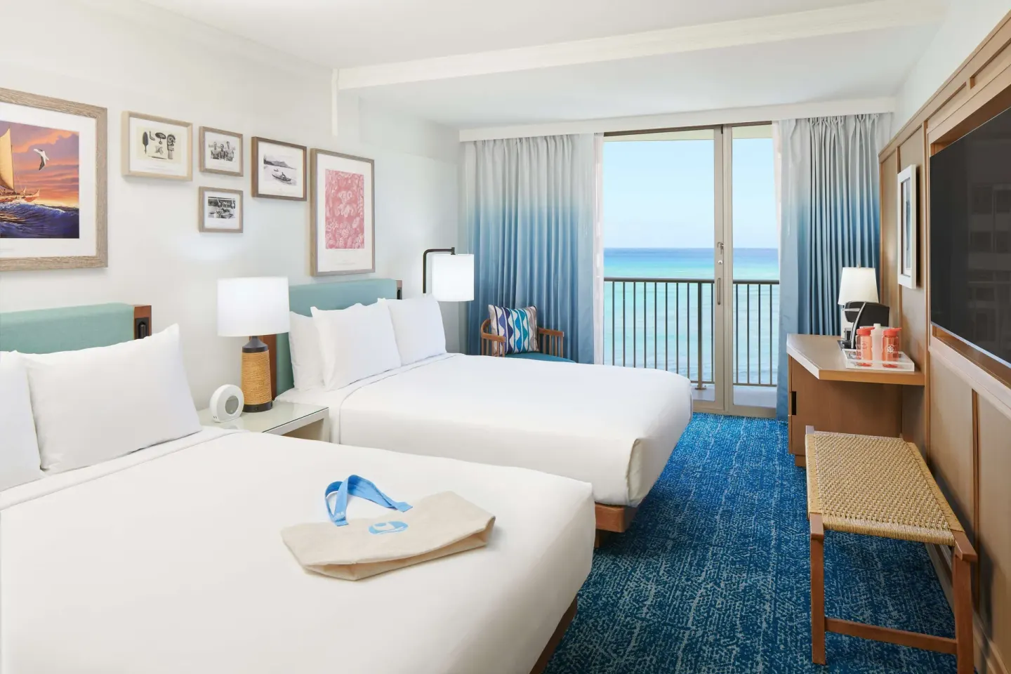 Two-bed oceanfront guest room with lanai at OUTRIGGER Reef Waikiki Beach Resort.