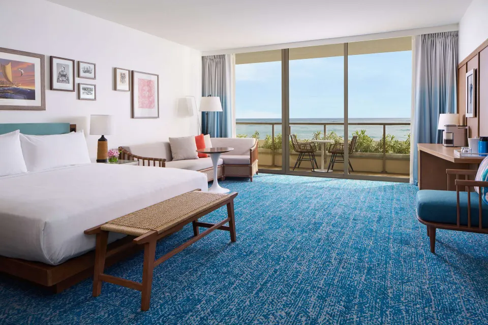 Club Room with king bed, sofa bed, and oceanfront balcony at OUTRIGGER Reef Waikiki Beach Resort.
