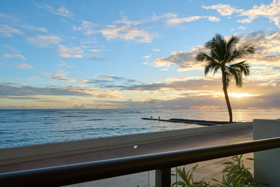 Oceanfront balcony sunset view from OUTRIGGER Reef Waikiki Beach Resort.