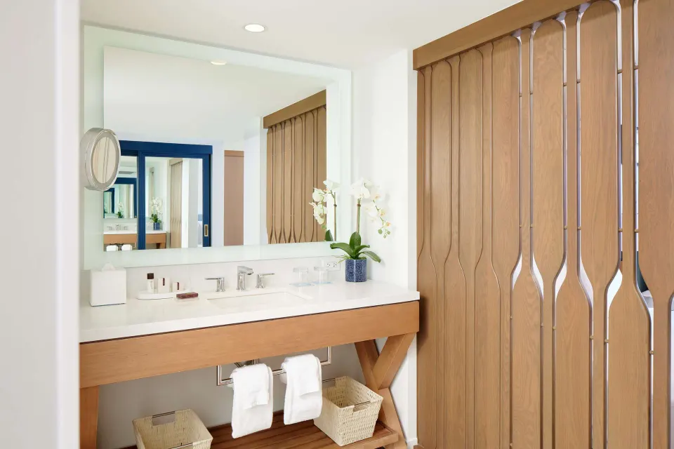 Bathroom vanity with wood screen at OUTRIGGER Reef Waikiki Beach Resort.