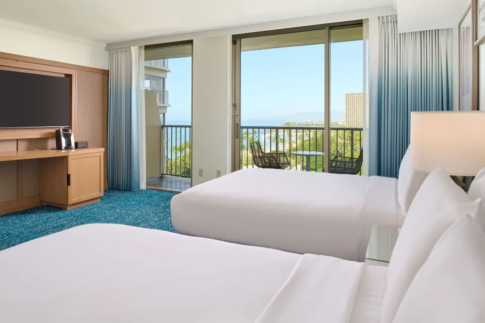Two-bed ocean view room with balcony at OUTRIGGER Reef Waikiki Beach Resort.