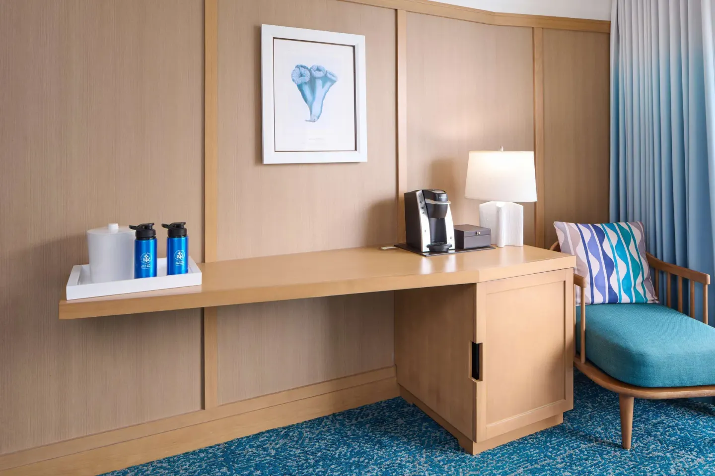 Desk and coffee station in a Partial Ocean View room at OUTRIGGER Reef Waikiki Beach Resort.