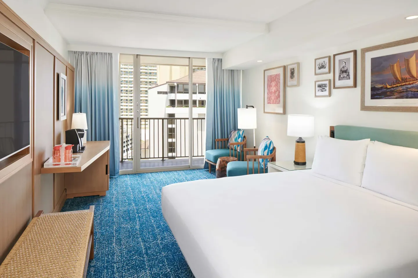 King bed in a Partial Ocean View room at OUTRIGGER Reef Waikiki Beach Resort.