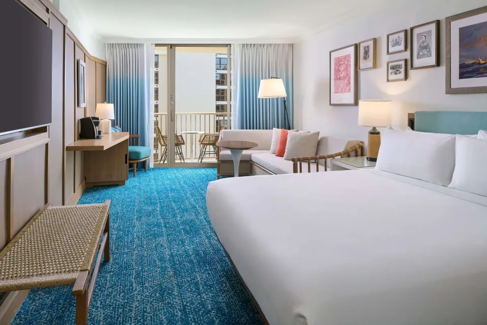 Resort View king guest room with balcony at OUTRIGGER Reef Waikiki Beach Resort.