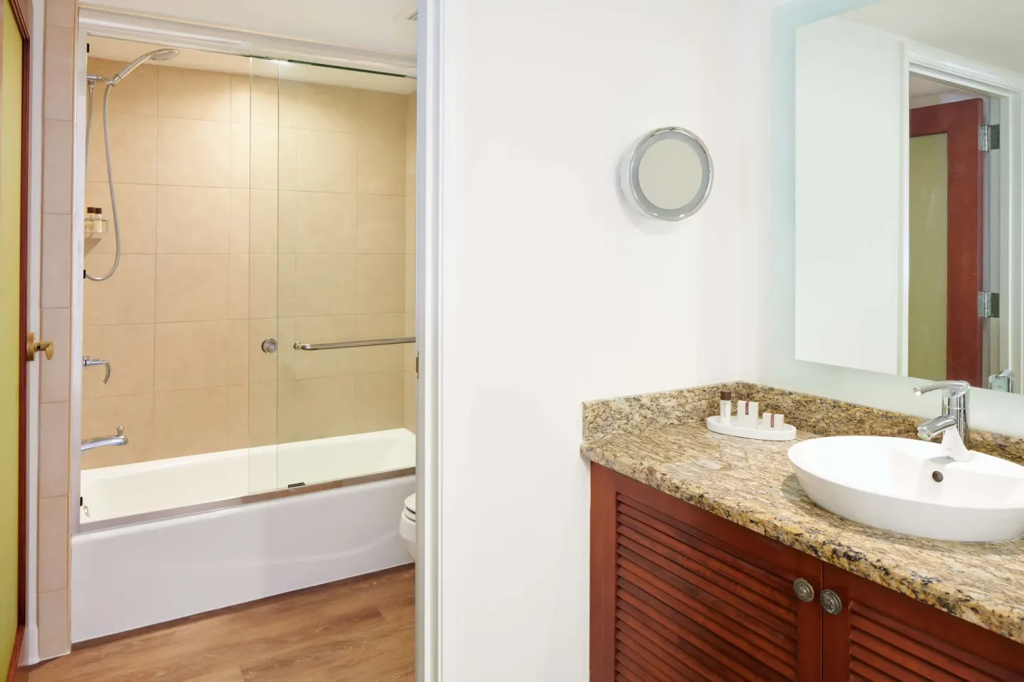 Standard Room bathroom vanity and tub shower at OUTRIGGER Reef Waikiki Beach Resort.
