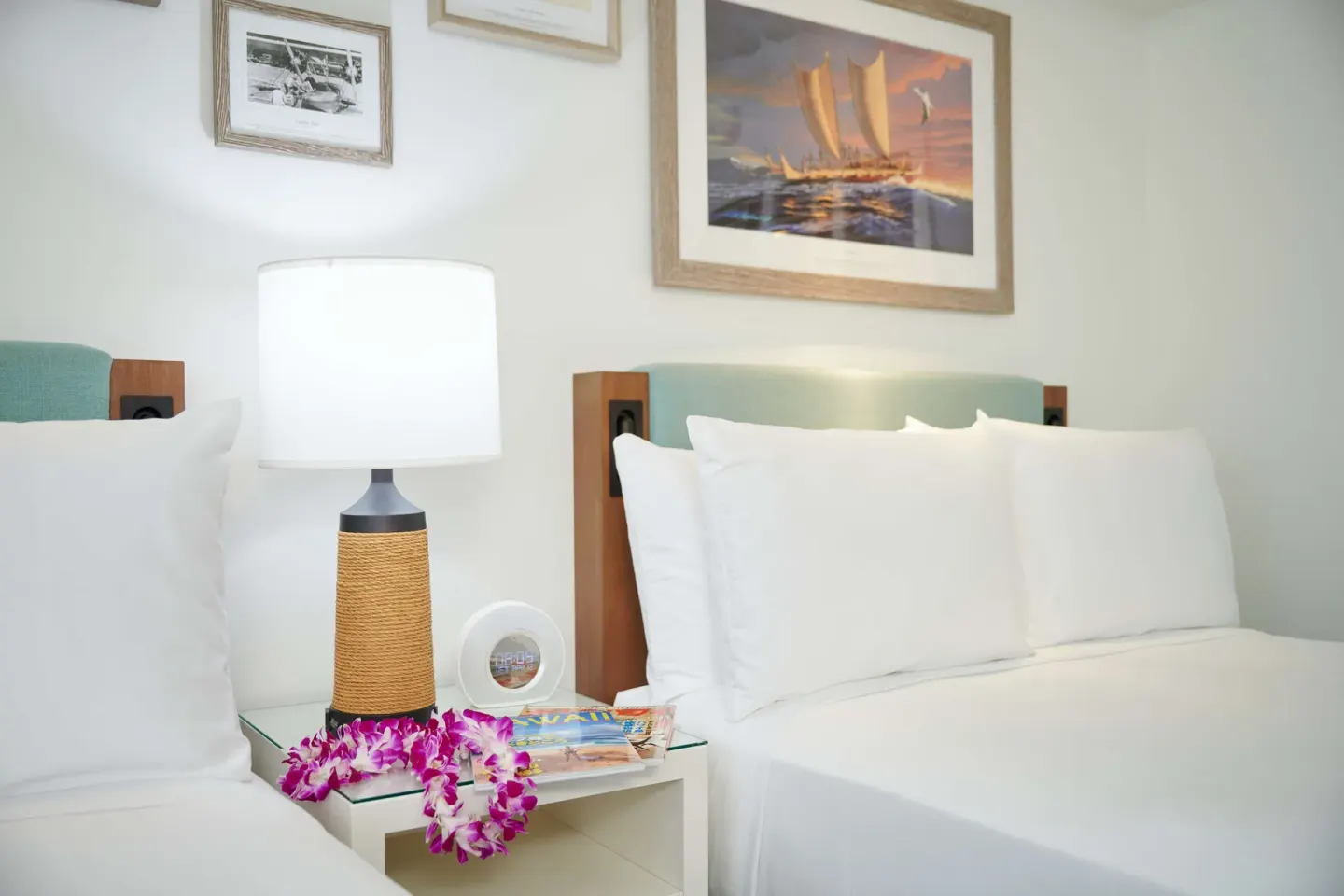 Standard Room bedside detail with white bedding at OUTRIGGER Reef Waikiki Beach Resort.