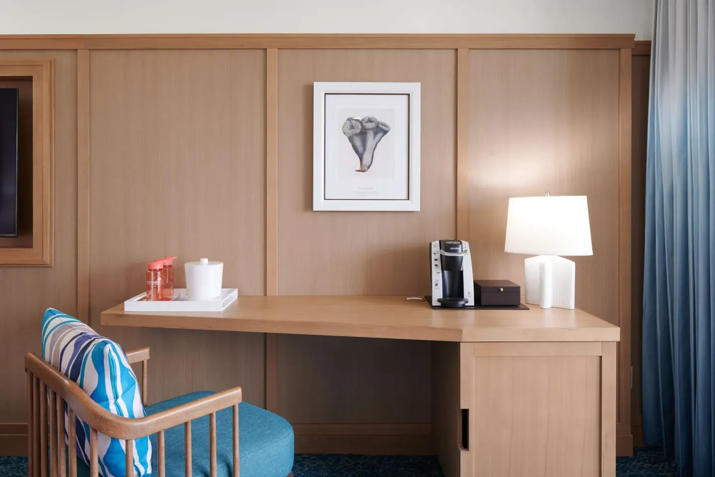 Standard Room desk with chair, coffee maker and lamp at OUTRIGGER Reef Waikiki Beach Resort.