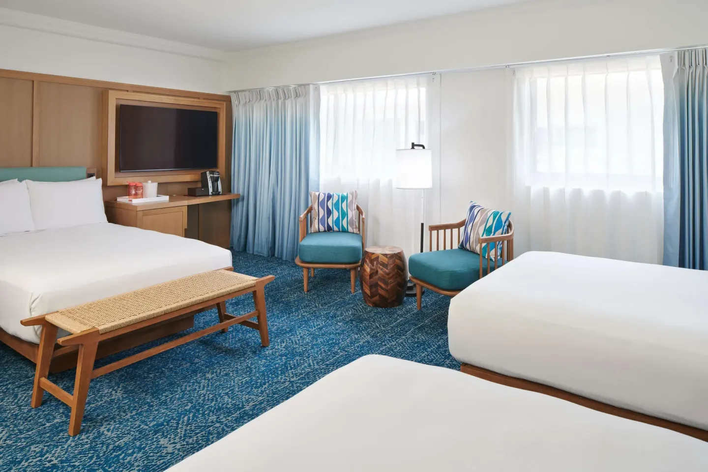 Standard Room with multiple beds and seating at OUTRIGGER Reef Waikiki Beach Resort.