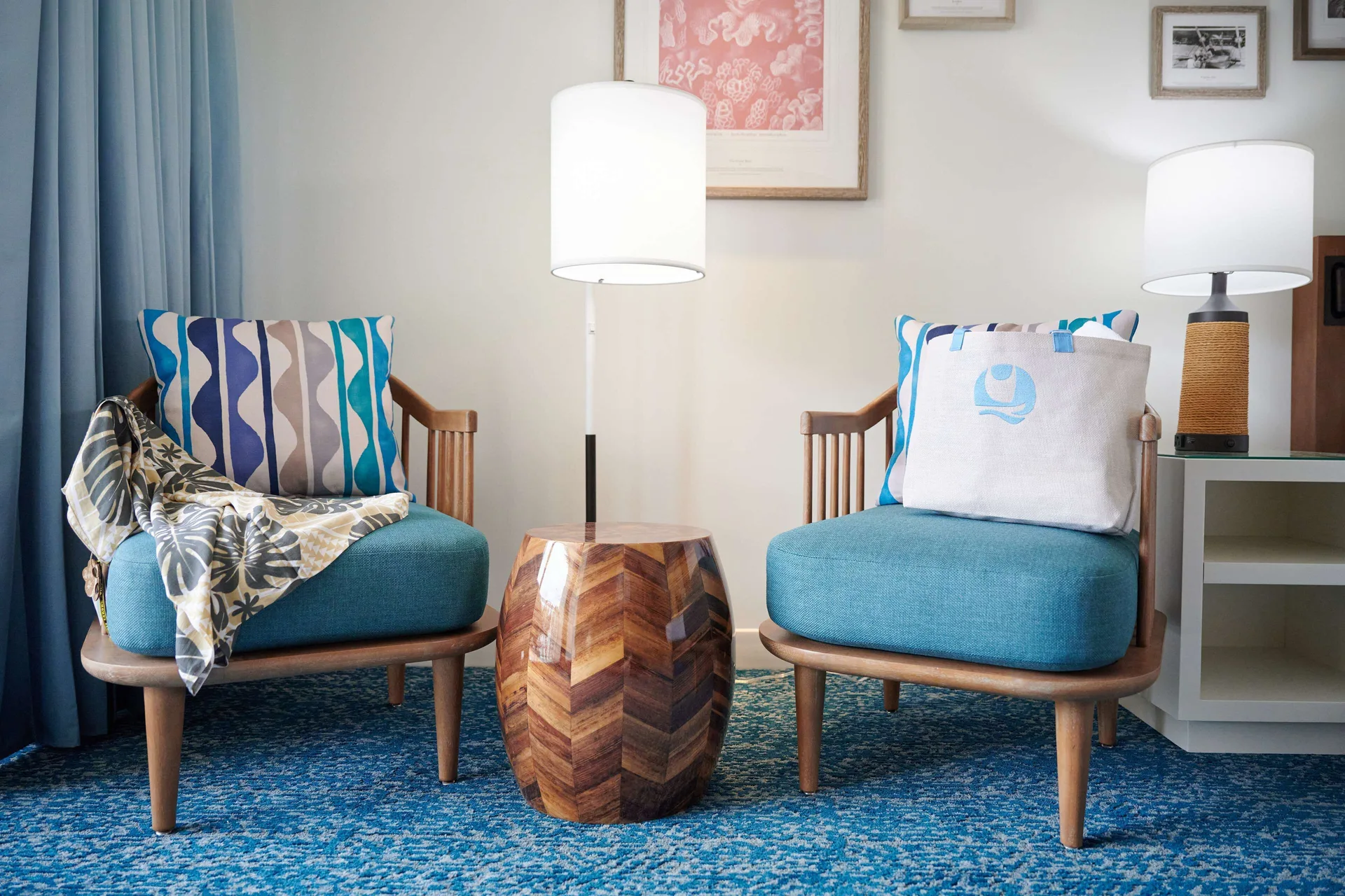 Standard Room seating with two teal chairs and lamp at OUTRIGGER Reef Waikiki Beach Resort.