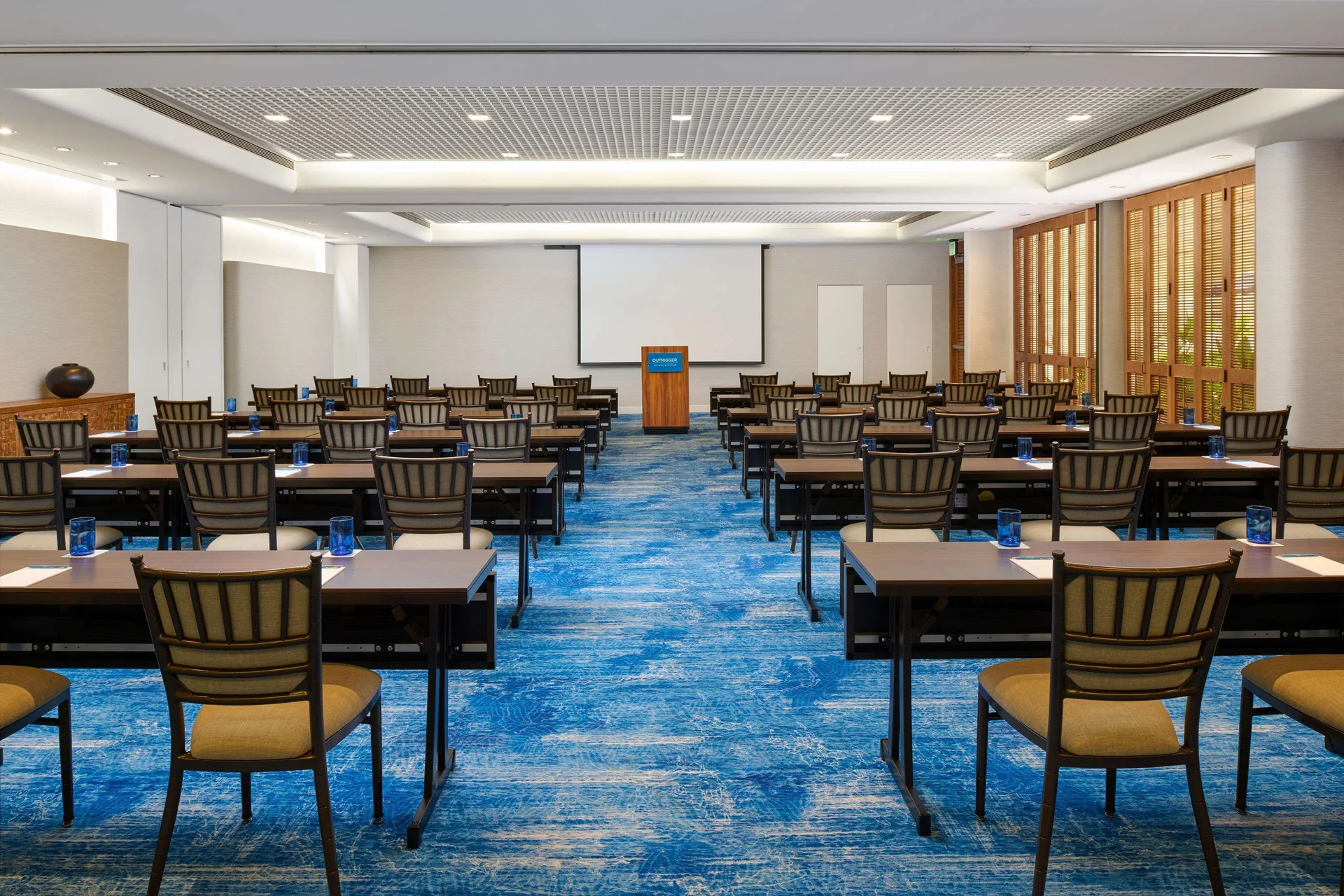 Classroom-style meeting room with podium at OUTRIGGER Reef Waikiki Beach Resort.