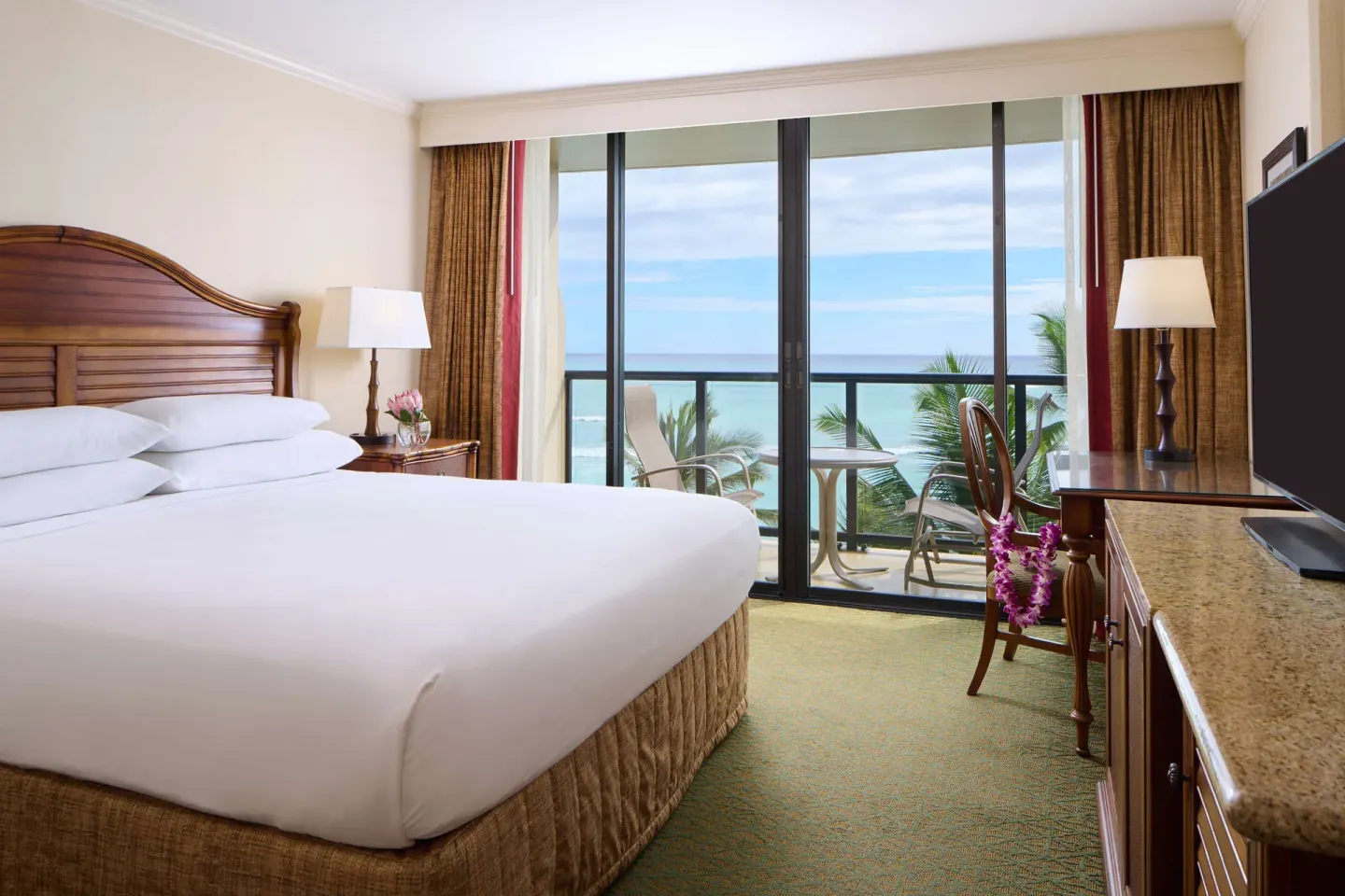 King guest room with oceanfront balcony at Outrigger Waikiki Beach Resort.