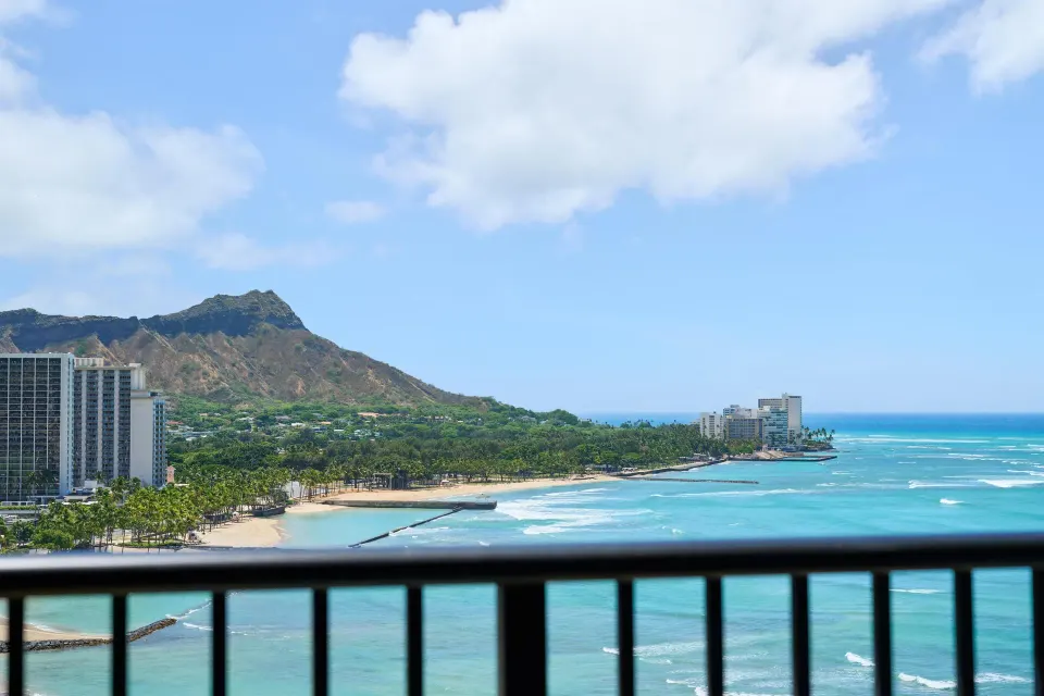 Oceanfront balcony view from Outrigger Waikiki Beach Resort showing Diamond Head and Waikiki shoreline.