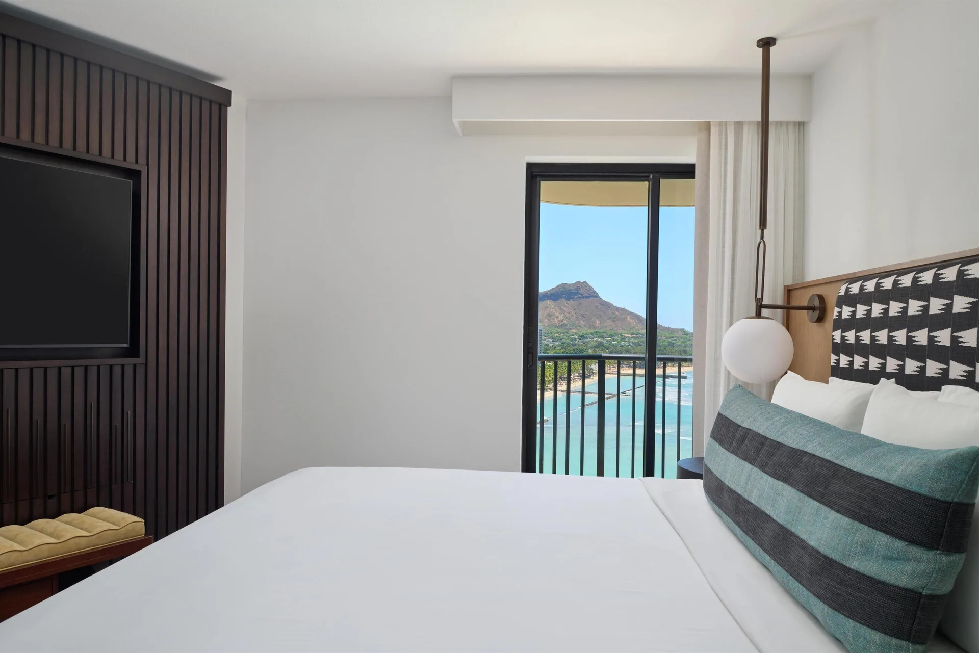 Bedroom in a Club Room 2 Bedrooms Oceanfront at Outrigger Waikiki Beach Resort with balcony view.
