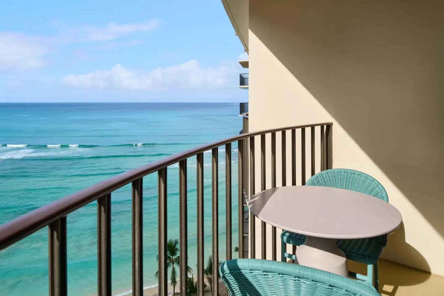 Club Room ocean-view balcony with chairs at Outrigger Waikiki Beach Resort.