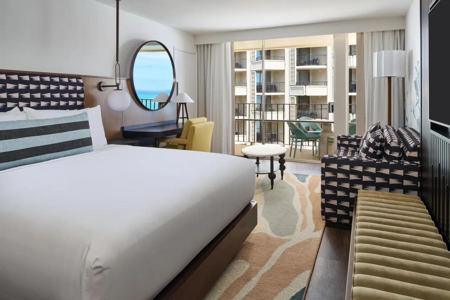 Club Room Ocean View king bed and balcony at Outrigger Waikiki Beach Resort.