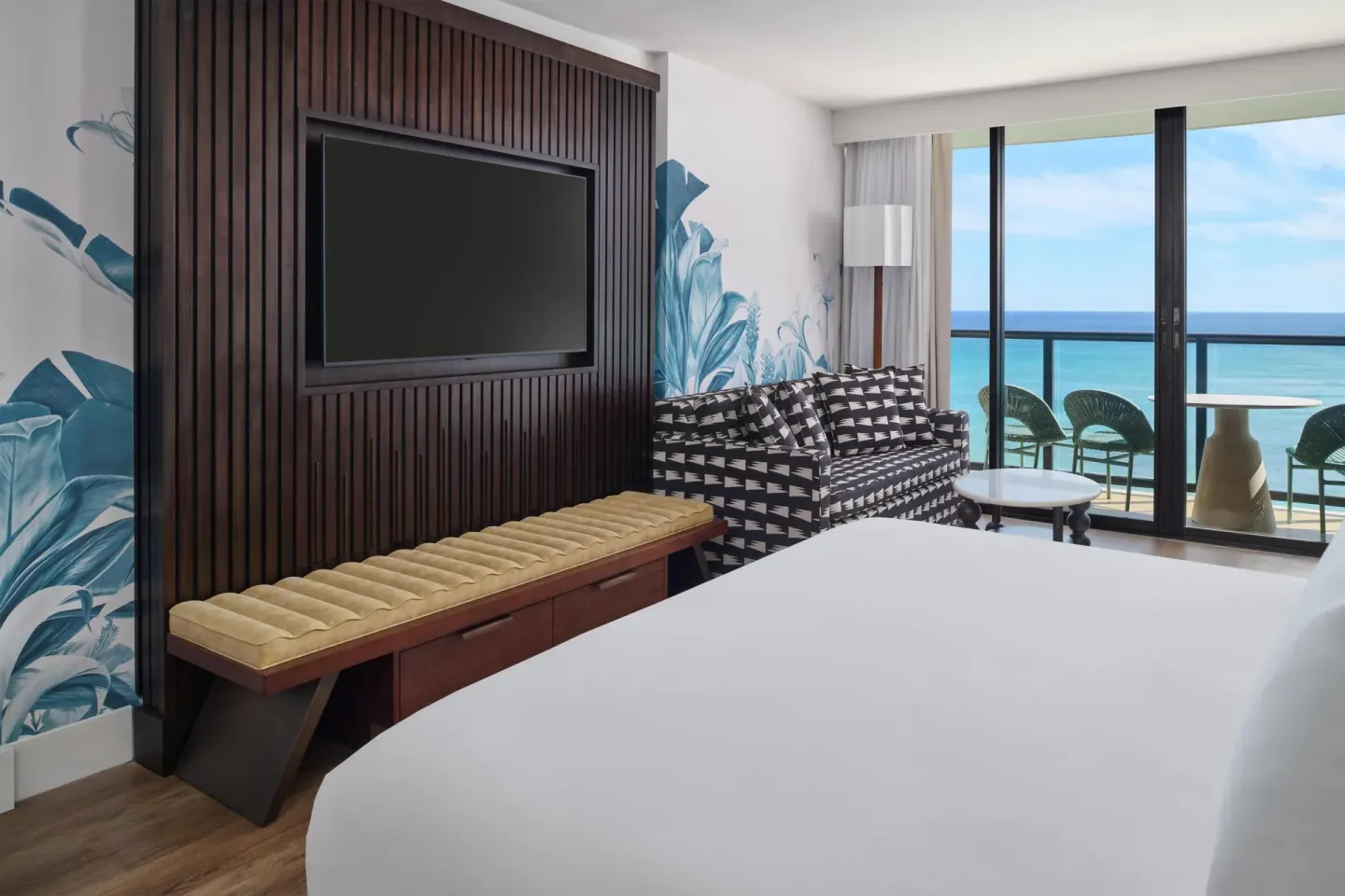 Club Room Oceanfront king bed with TV wall and ocean balcony at Outrigger Waikiki Beach Resort.
