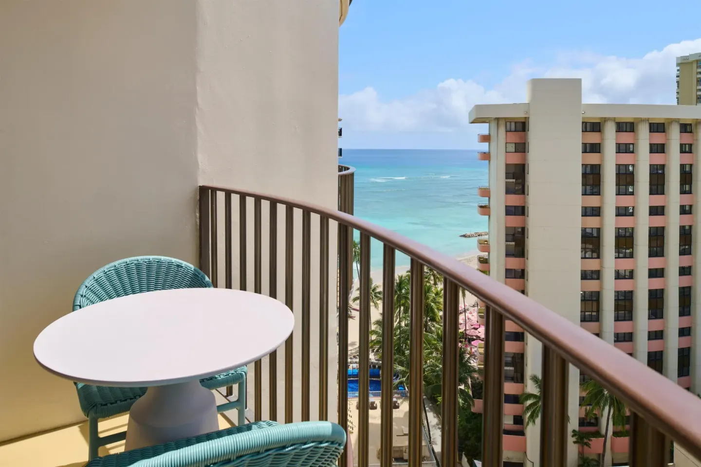 Club Room Partial Ocean View balcony with ocean between towers at Outrigger Waikiki Beach Resort.