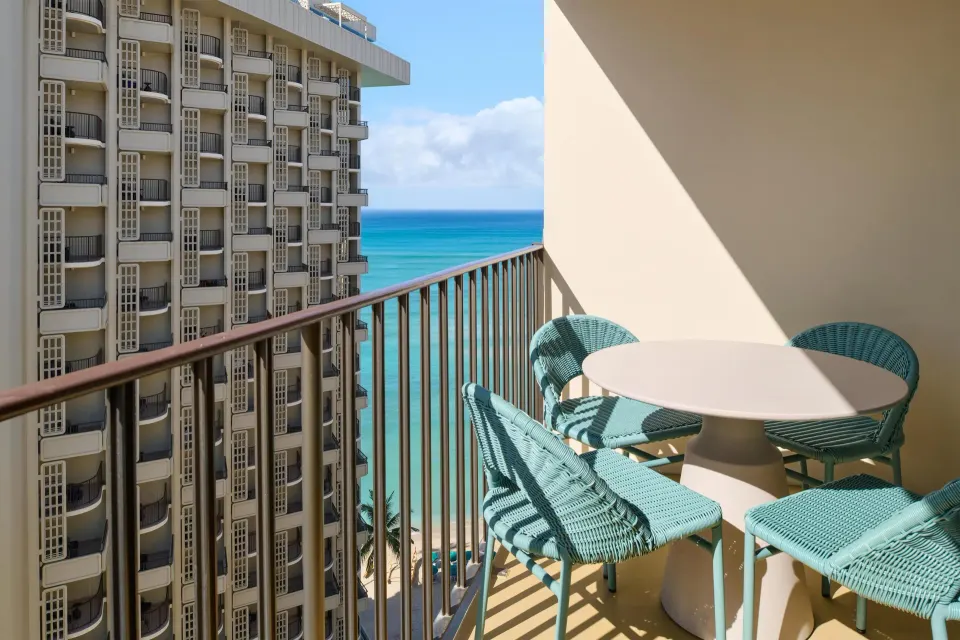 Club Room Partial Ocean View balcony seating at Outrigger Waikiki Beach Resort.