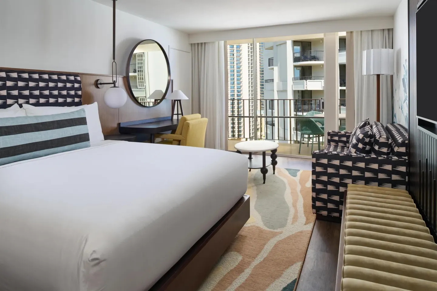 Club Room Partial Ocean View king bed and balcony at Outrigger Waikiki Beach Resort.