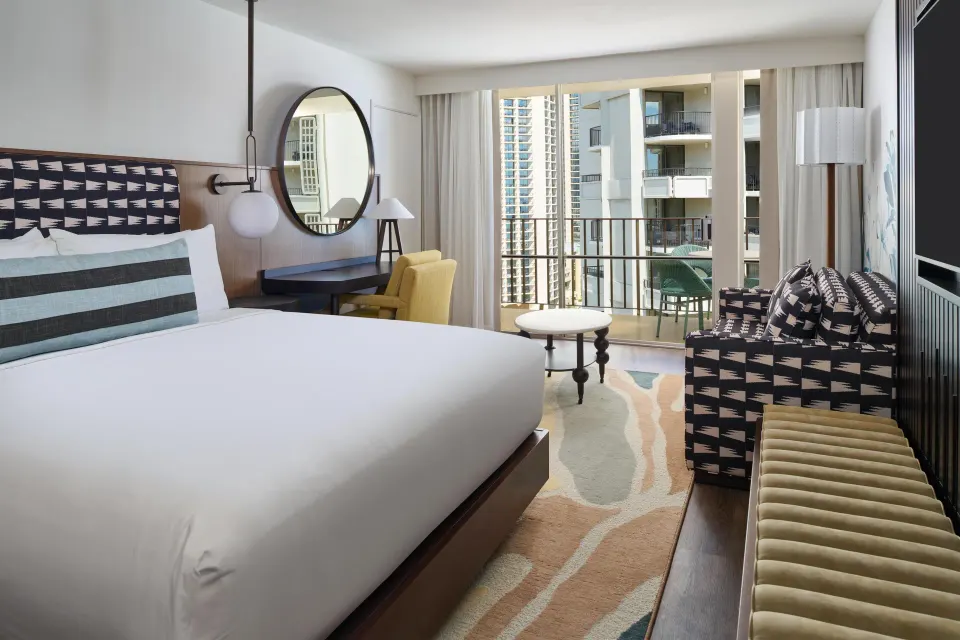Club Room Partial Ocean View king bed and balcony at Outrigger Waikiki Beach Resort.