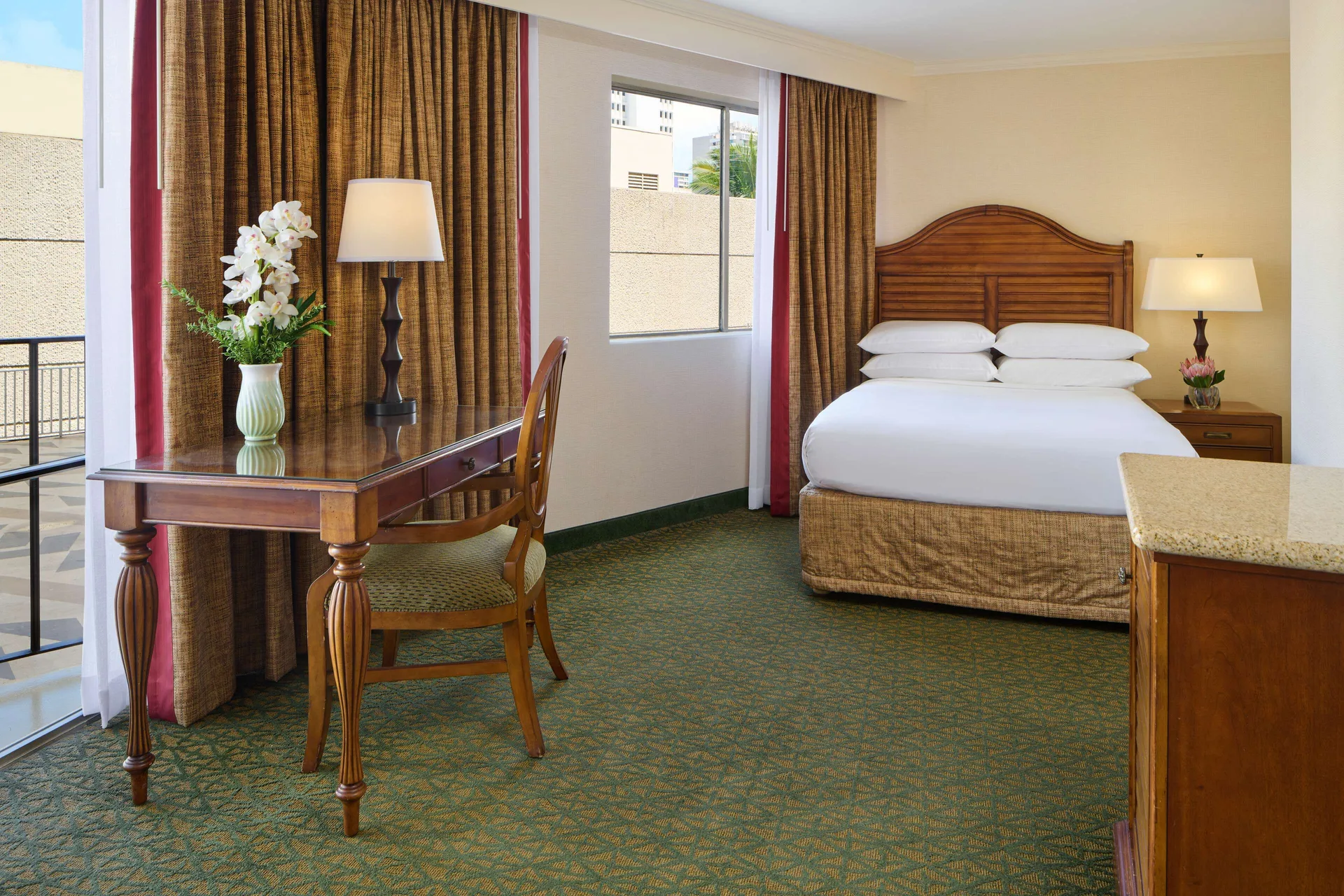 City View room with king bed, desk, and balcony at Outrigger Waikiki Beach Resort.