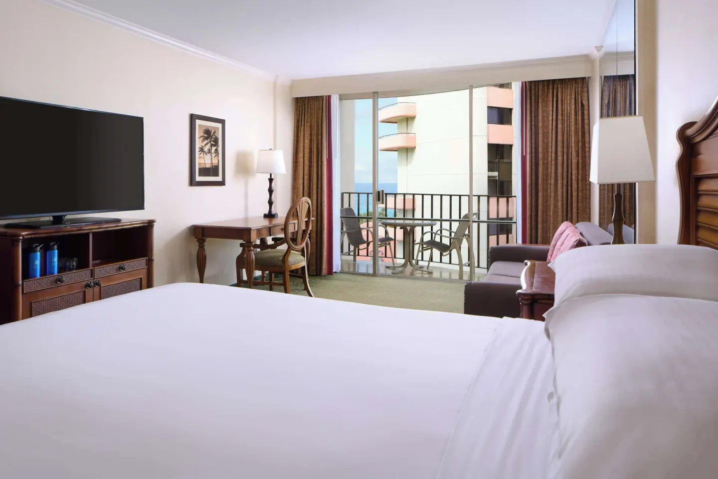 Ocean view king bed room with balcony at Outrigger Waikiki Beach Resort.