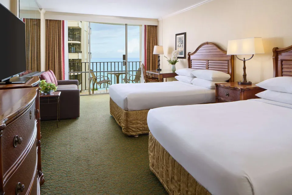 Ocean view room with two beds and balcony at Outrigger Waikiki Beach Resort.