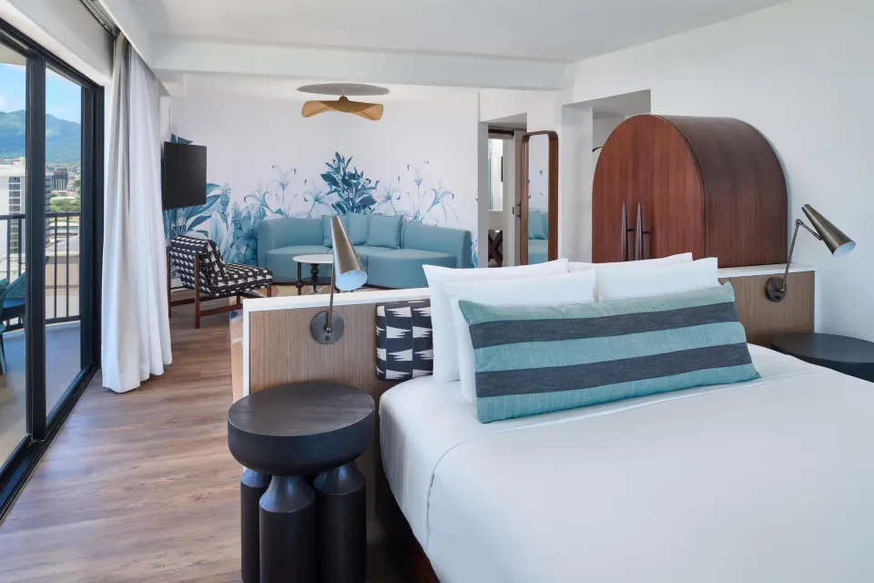 Suite with bed and sitting area at Outrigger Waikiki Beach Resort.