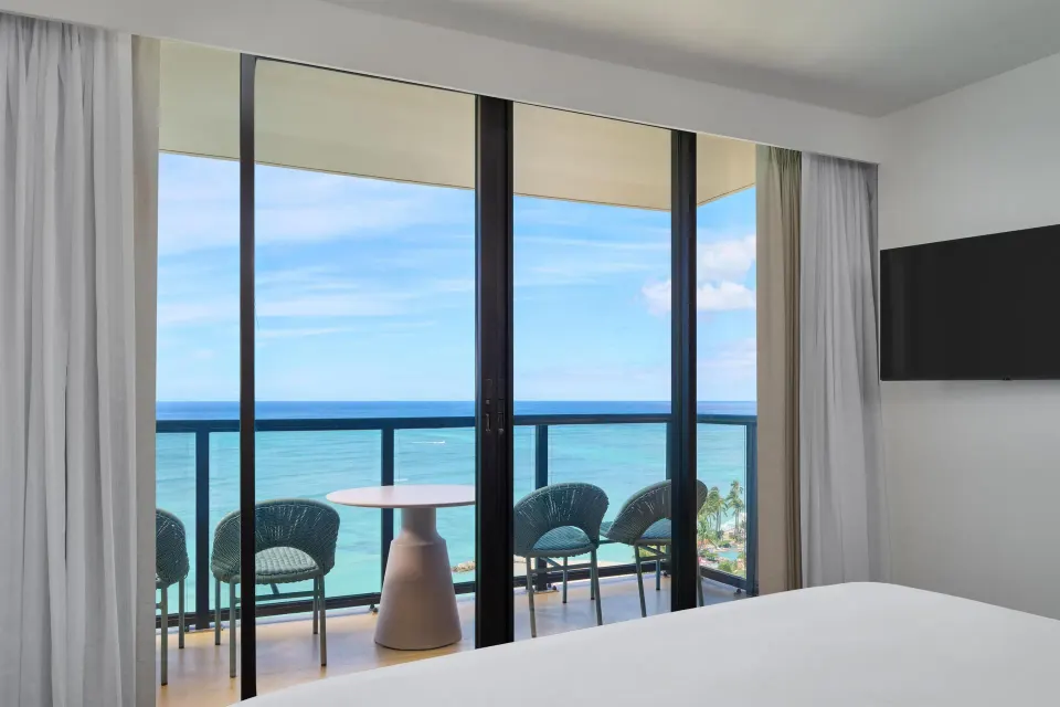 Suite bedroom balcony with ocean view at Outrigger Waikiki Beach Resort.