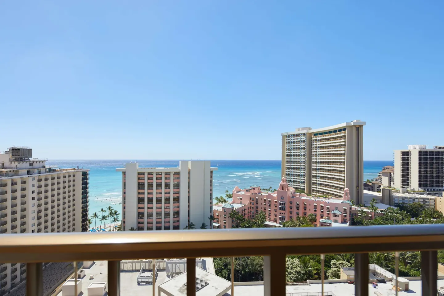 Balcony view toward Waikiki Beach, ocean, and surrounding hotels at OUTRIGGER Waikiki Beachcomber Hotel.