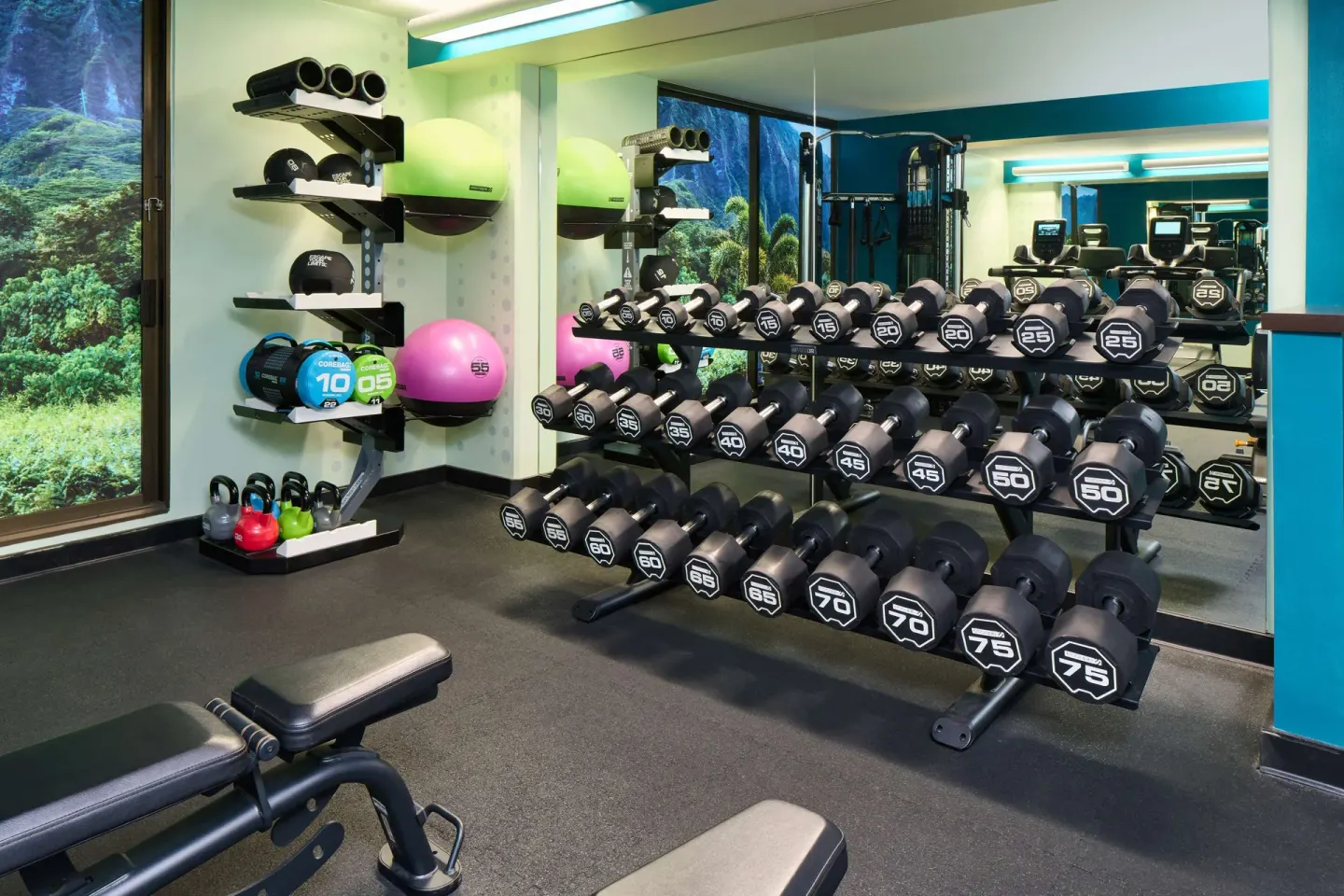 Fitness room dumbbell rack and workout gear at OUTRIGGER Waikiki Beachcomber Hotel.