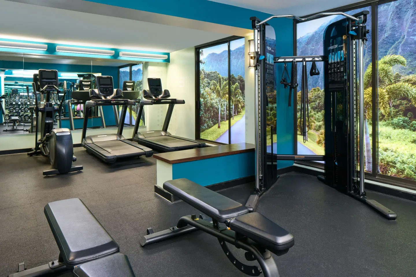 Fitness room treadmills and cable machine at OUTRIGGER Waikiki Beachcomber Hotel.