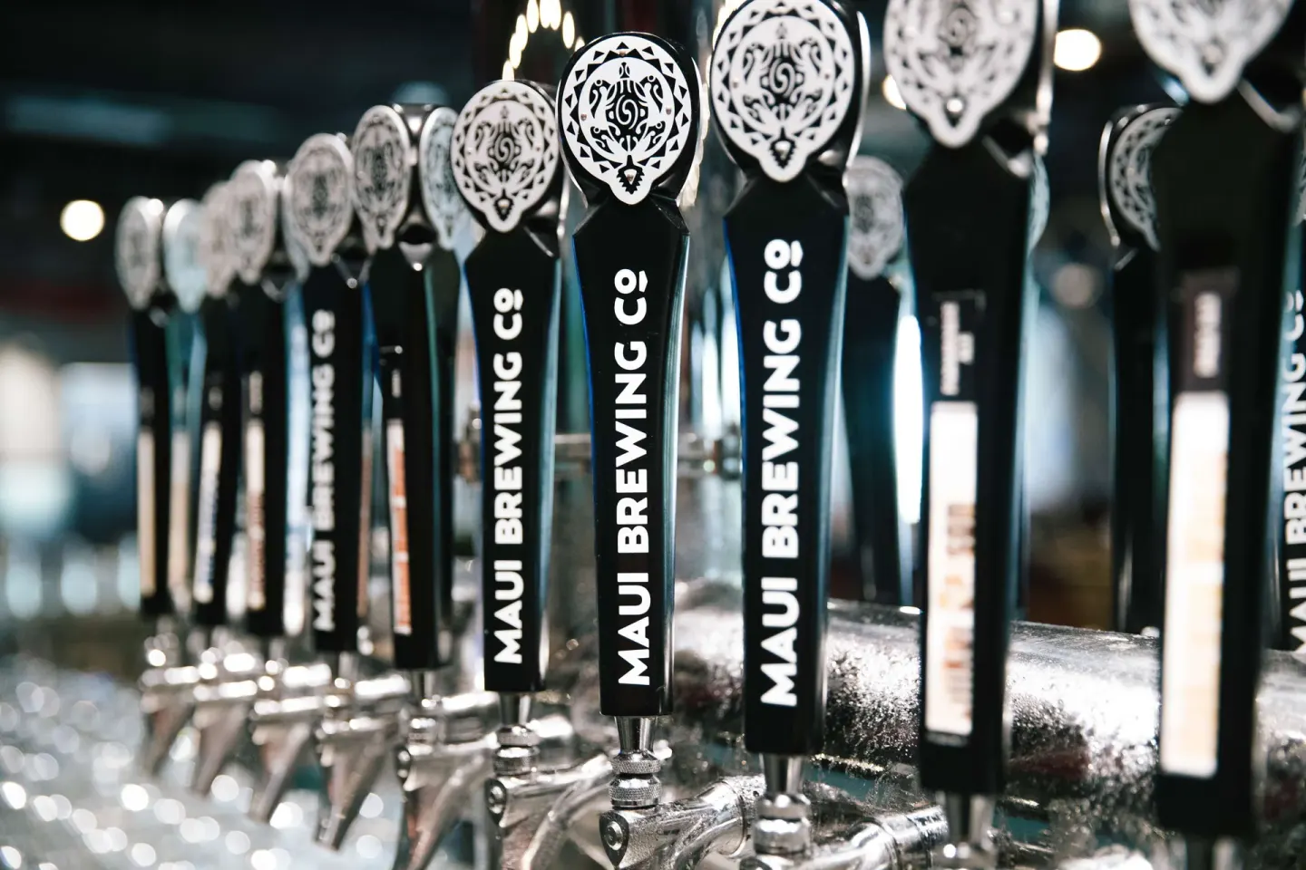 Maui Brewing Co. tap handles lined up at OUTRIGGER Waikiki Beachcomber Hotel.