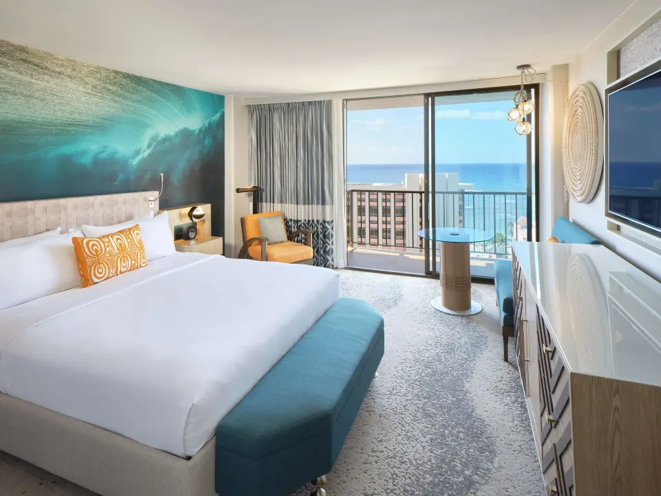 King guest room with ocean view balcony at OUTRIGGER Waikiki Beachcomber Hotel.