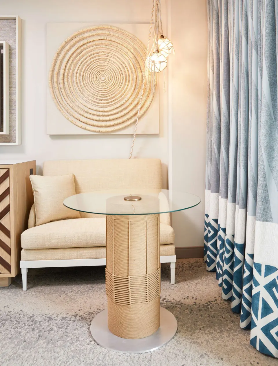Guest room sitting nook with glass table at OUTRIGGER Waikiki Beachcomber Hotel.