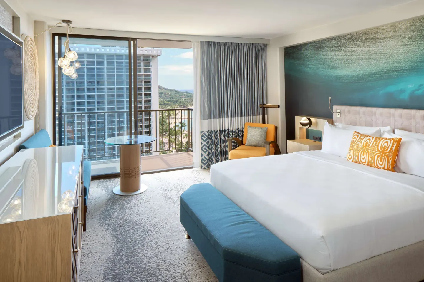 Ocean View guest room with king bed and balcony at OUTRIGGER Waikiki Beachcomber Hotel.